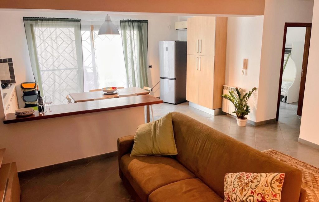 Living room with a large sofa that opens into a double bed