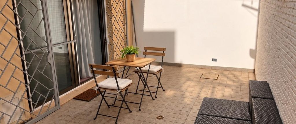 Private courtyard with bistro table and chairs